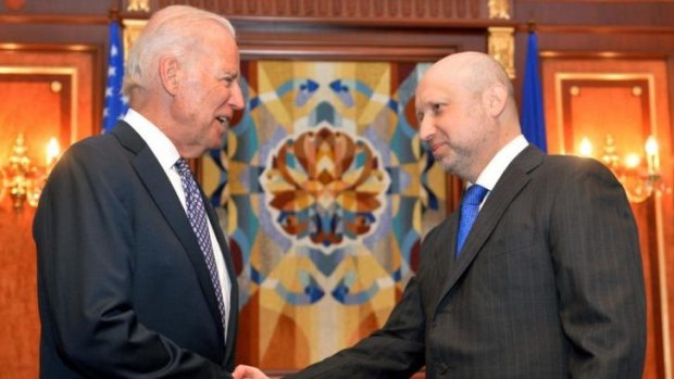 Firm support ... US Vice President Joe Biden, left, is greeted by Oleksandr Turchynov, the acting Ukrainian prime minister.