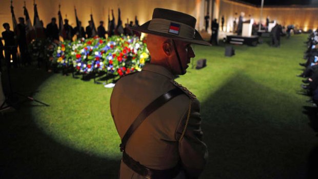 An Australian soldier stands before the wreath-laying ceremonies at the Australian National Memorial in Villers-Bretonneux.