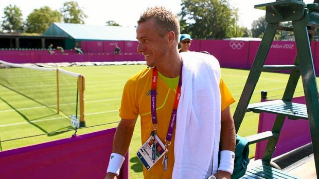 Lleyton Hewitt leaves the court after training in London.