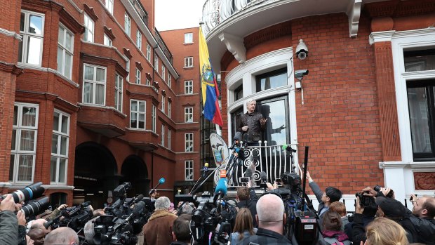 Julian Assange speaks to the media.
