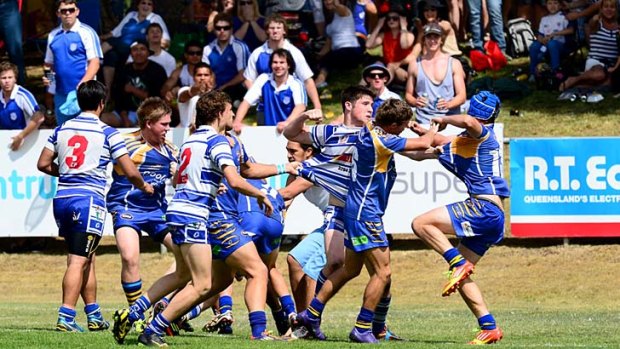 Players fight during the Under-18s Cup match between Northern Suburbs Tigers and Brothers.