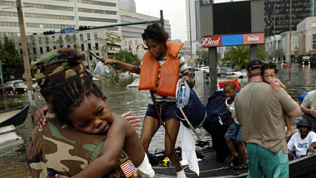 New Orleans residents arrive to shelter at the Louisiana Superdome in the aftermath of Hurricane Katrina, August 2005.