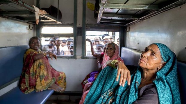 Sondi (no last name given, at right) sits with friends from Maharashtra state in a women-only carriage on a train from New Delhi's Nizamuddin Station destined for Gondwana in Vidarbha region of Maharashtr.