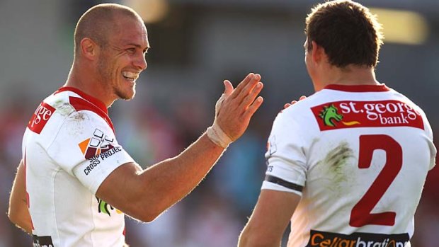 Matt Cooper of the Dragons celebrates with Brett Morris after scoring the first of his two tries.