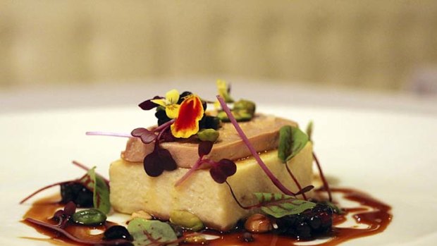 Warm chicken mousse with foie gras, mulberries and hazelnuts with calvados jus.