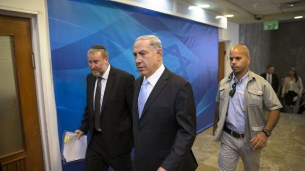 Spoke to the boy's father: Israeli Prime Minister Benjamin Netanyahu arrives at a cabinet meeting in Jerusalem on Sunday. 