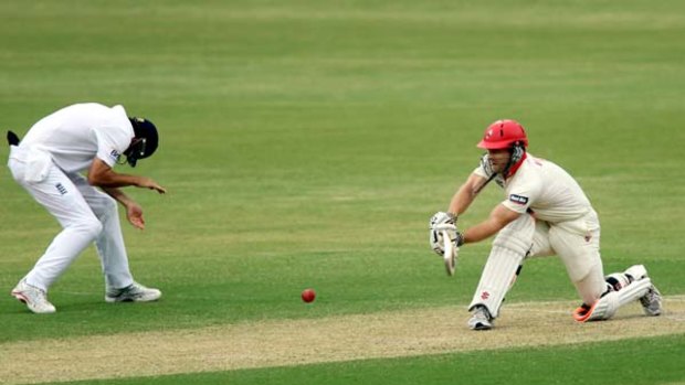 Take cover . . . an England fielder braces as South Australia's Aiden Blizzard hits out on his way to 49 in Adelaide yesterday.
