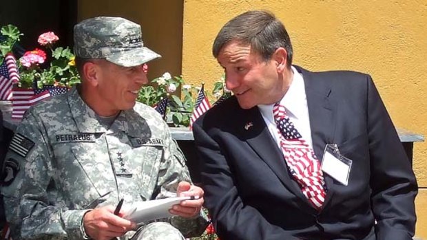 Big job ... General David Petraeus talks to the US ambassador to Afghanistan Karl Eikenberry at an Independence Day ceremony in Kabul.