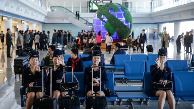 Air Koryo flight attendants at Pyongyang Airport.