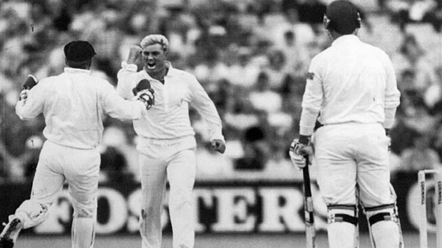 Australian bowler Shane Warne (C) and keeper Ian Healy celebrate after Mike Gatting was clean bowled by Warne with his first ball on the second day of the first Test, June 4, 1993.
