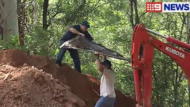 Police excavate the backyard of a Gold Coast home.