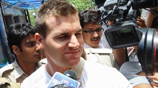 Australian cricketer Luke Pomersbach leaves the hospital on his way to a local court for a hearing in New Delhi in May 2012. Pomersbach was arrested on molestation and assault charges.