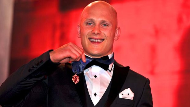 Gary Ablett shows off his second Brownlow Medal.