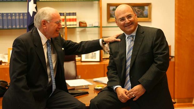 Former PM John Howard, pictured with Arthur Sinodinos in 2006, has released a statement in support for his former chief of staff.