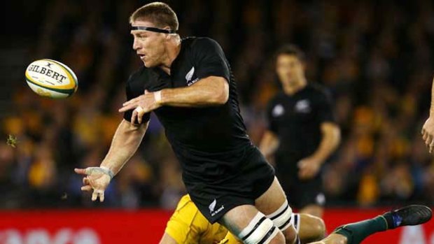 All Black star Brad Thorne gets a pass away during New Zealand's win against Australia last night.