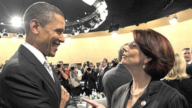 The Prime Minister, Julia Gillard, and US President, Barack Obama, talk at the NATO summit.