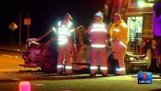 Firefighters at the scene of the fiery crash on the Warrego Highway. 