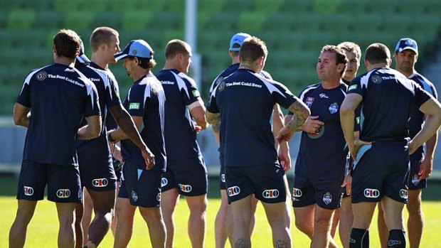 NSW state-of-origin coach Ricky Stuart talks to his players during a training session in Melbourne.