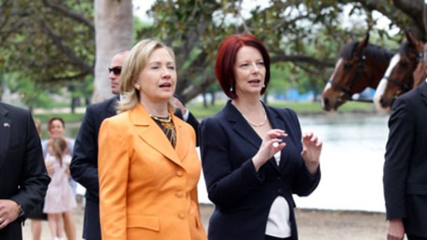 Power walking ... Hillary Clinton and Julia Gillard talk  on the banks of the Yarra River during a break from  meetings yesterday.