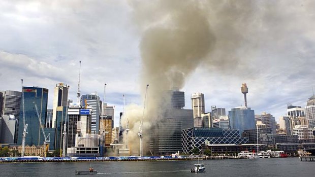 Fire breaks out: Smoke billows from the Barangaroo construction site on Wednesday afternoon.