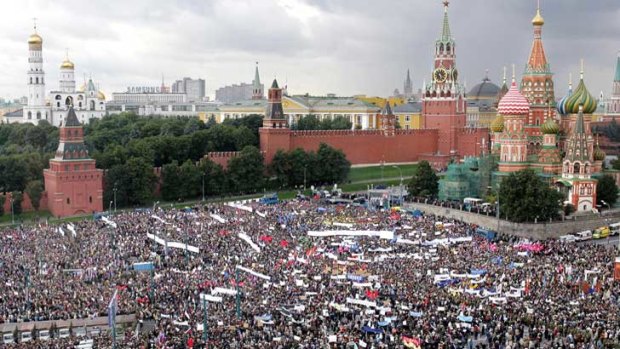 People take part in an anti-terror meeting in Red Square, Moscow, after the hostage-taking tragedy in Beslan.