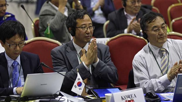 Representatives from South Korea attend a meeting on the last day of the 64th annual International Whaling Commission meeting in Panama City.