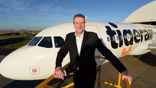 Tiger chief executive Rob Sharp unveils the airline's new logo.