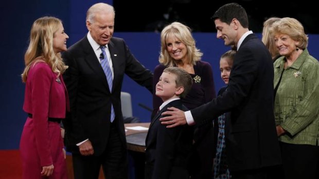 Friendly moment ... members of the Biden and Ryan families greet one another on stage after the debate.