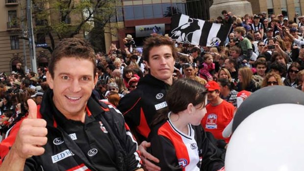 Steven Baker (left), who returns to the St Kilda side today, is all smiles with Lenny Hayes at yesterday's grand final parade.