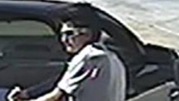Police want to trace this man filling the stolen car up with fuel. 