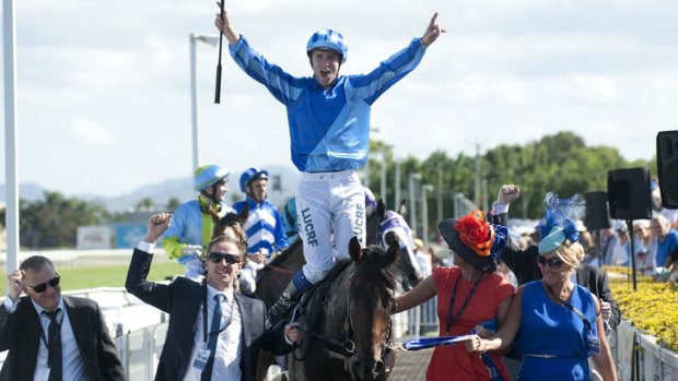Two million dollar man: Nathan Berry celebrates after winning the Magic Millions Classic on Unencumbered for trainer Bjorn Baker.