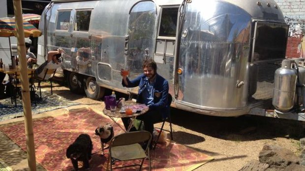 Henry Wagons and his dogs enjoy some sunshine outside the Grub Food Van.