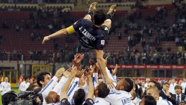 Javier Zanetti's teammates celebrated with him after the match.
