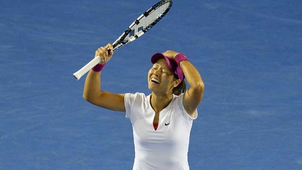Li Na after completing a straight sets win in the women's final.