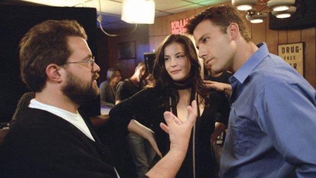 Director Kevin Smith, left, with Liv Tyler and Ben Affleck on the set of 2004 film <i>Jersey Girl</i>.