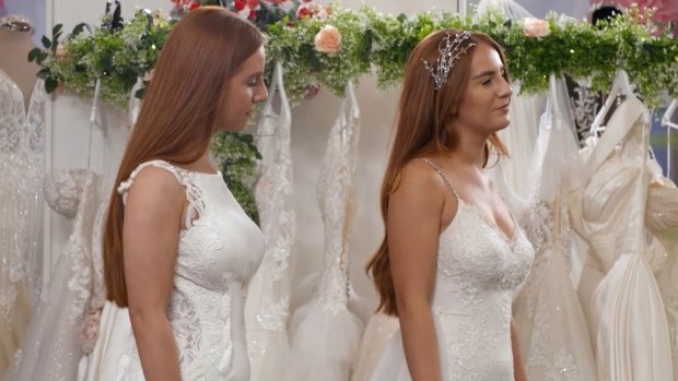 Identical twin Caitlin is unhappy with her sleeveless wedding dress