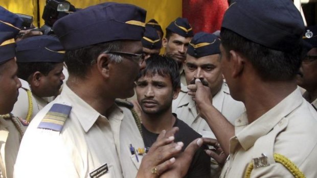 Death penalty ... Police escort one of the four men on gang-rape charges to a court in Mumbai, India. 