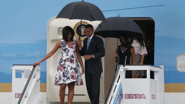 US President Barack Obama, Michelle Obama and Sasha Obama (right) arrive at Jose Marti International Airport on Air Force One for a 48-hour visit to Cuba.