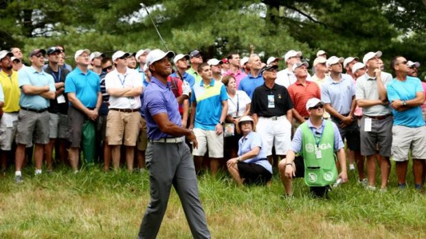 Rough shot: Tiger Woods was nine strokes off the lead after the first round of the US PGA Championship.