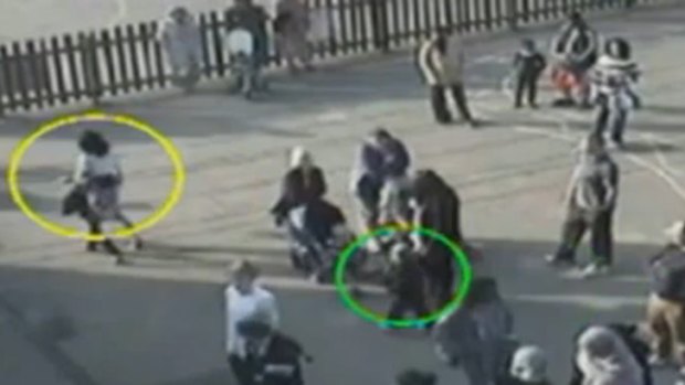 In CCTV footage released to the UK press, little Daniel, right, can be seen trailing after his mother in the schoolyard just hours before his death.