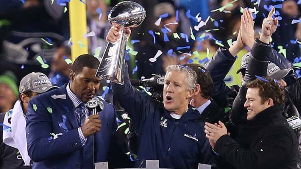 Champions: Seattle Seahawks coach Pete Carroll celebrates with the Vince Lombardi Trophy.