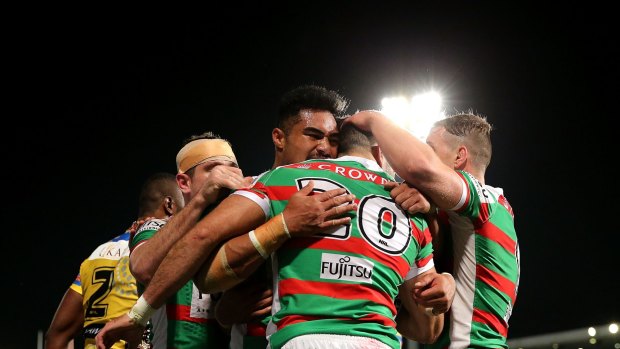 The Rabbitohs celebrate the opening try of the match at Pirtek Stadium.