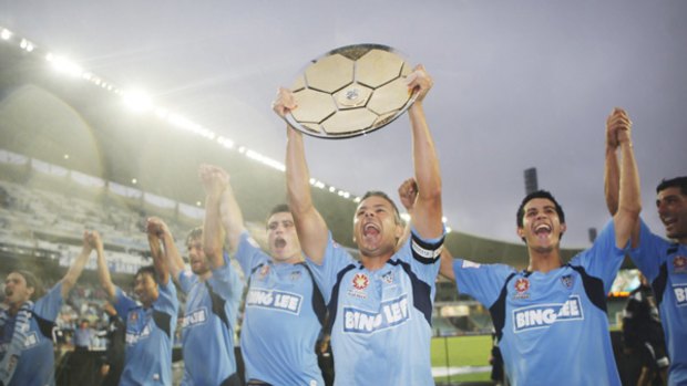 The Sydney FC players celebrate with the club's first Premiership Plate gained from  the 2-0 victory over Melbourne at the Sydney Football Stadium.