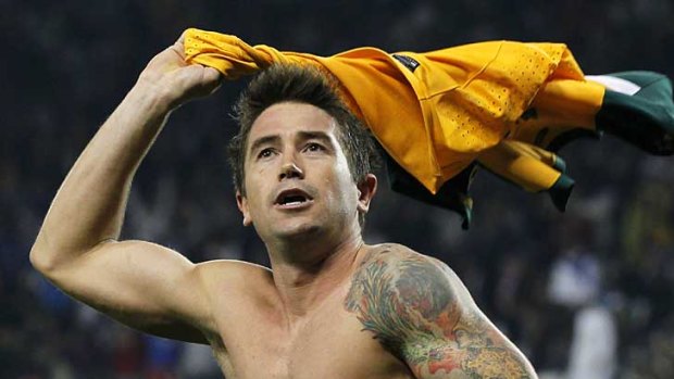 Harry Kewell, pictured celebrating a goal at this year's Asian Cup, has signed with Melbourne Victory.