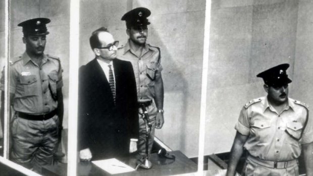 "Guilty before God" ... former senior Nazi Adolf Eichmann stands in a glass cage during his 1961 trial in an Israeli court, which sentenced him to death.