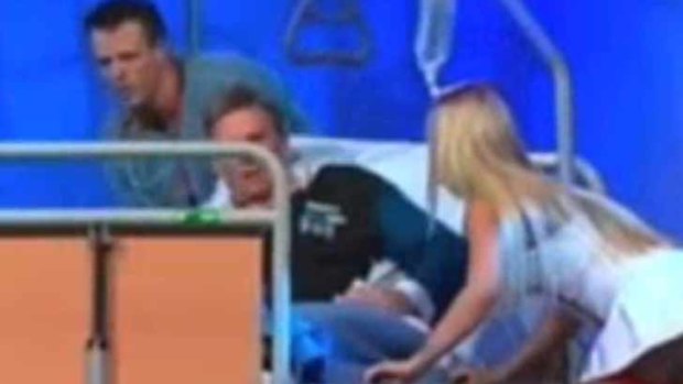 Newman was rolled off a hospital bed by a high-skirted nurse during The Footy Show.