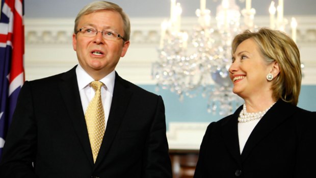 Australian Prime Minister Kevin Rudd speaks as US Secretary of State Hillary Clinton looks on.