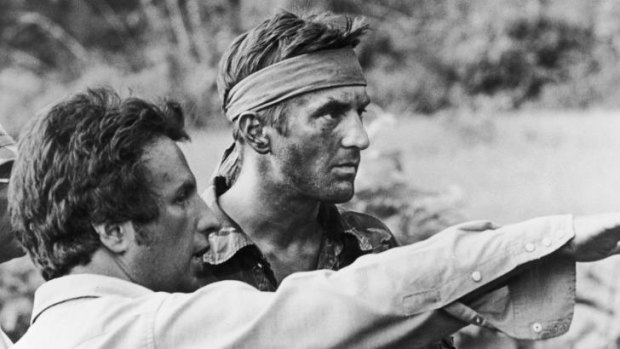Director Michael Cimino, left, confers with Robert De Niro on the set of <i>The Deer Hunter</i>.  