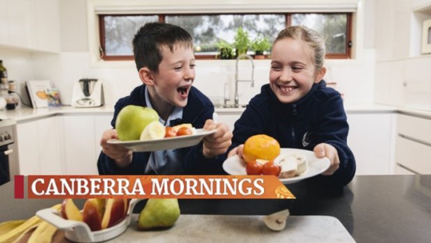 Lucas and Emily Olive enjoy their healthy afternoon tea of fruit rather than sugar-packed snacks. 