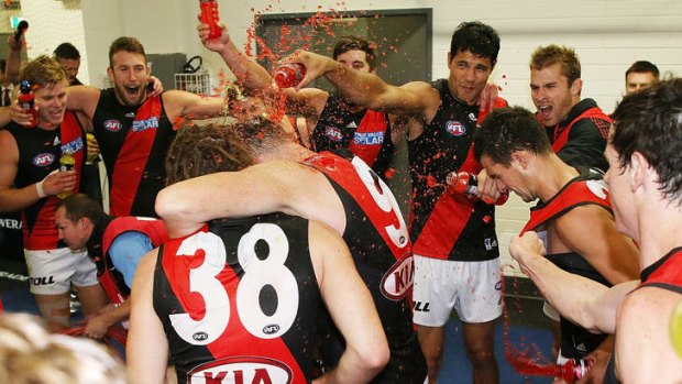 Jubilant Bombers celebrate their win over Adelaide on Friday night.